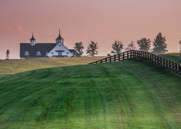 Black Fence Leads over the Hill — Stock Photo, Image