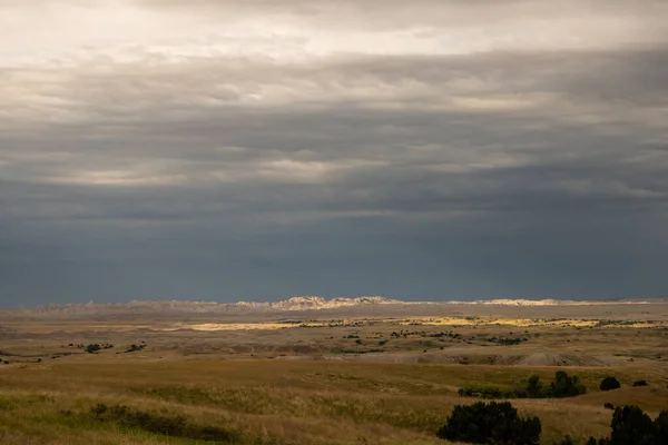 Light Patches Brighten Stormy Prairie Front Badlands Formations South Dakota — Stock Photo, Image