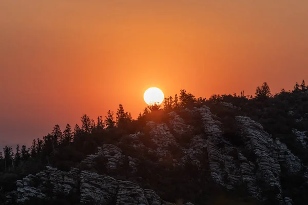 Bright Orange Sun Rises Over Ridge in Great Basin National Park
