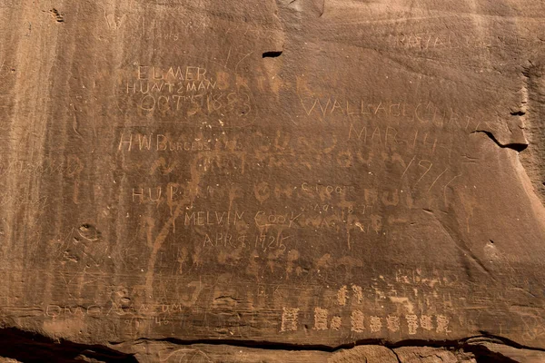 Historic Names Etched into Sandstone Wall of Early Explorers to Capitol Reef National Park