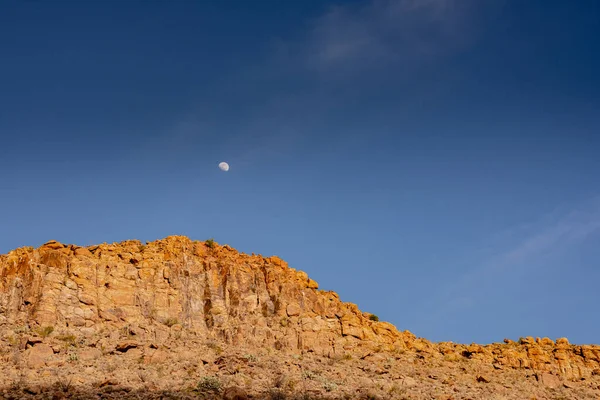 Moon Hangs Blue Sky Sunlit Orange Cliffs Grapevine Hills Big — Stock Photo, Image