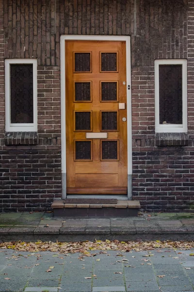 Wooden door and windoes in European town — Stock Photo, Image