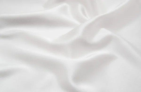 Tecido de cetim branco como fundo — Fotografia de Stock
