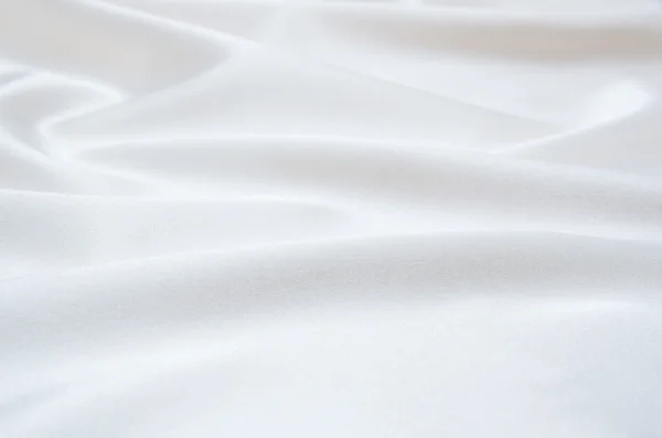 Bílá saténová tkanina jako pozadí — Stock fotografie