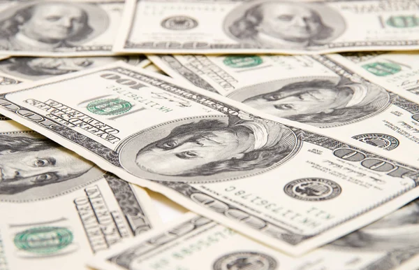 One hundred dollars pile as background. Stock Image