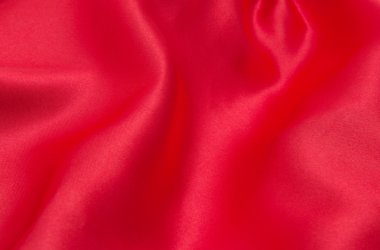 Arkaplan olarak kırmızı saten veya ipek kumaş