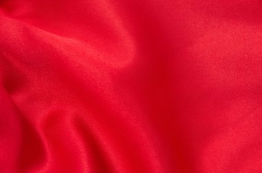 Arkaplan olarak kırmızı saten veya ipek kumaş