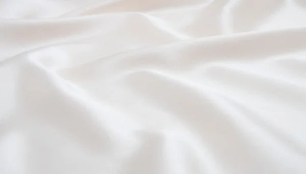 Біла атласна тканина як фон — стокове фото