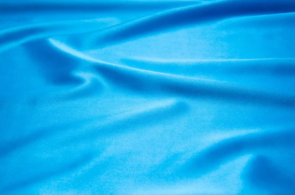 Blå satin som bakgrund — Stockfoto