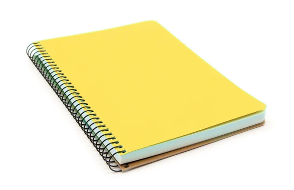 Cuaderno amarillo aislado sobre fondo blanco — Foto de Stock