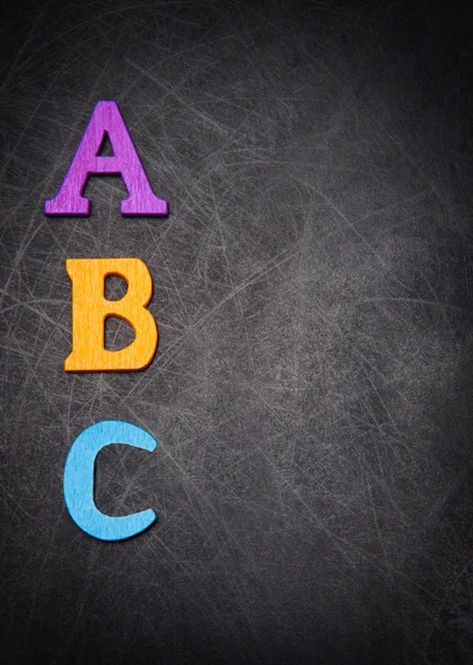 ABC bokstäver på svart bakgrund — Stockfoto