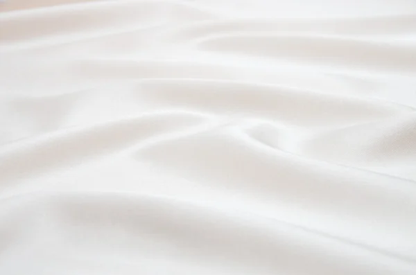 Белый атласная ткань в качестве фона — стоковое фото