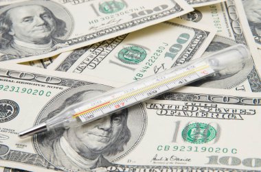 Tıbbi termometre, dolar arkaplanı