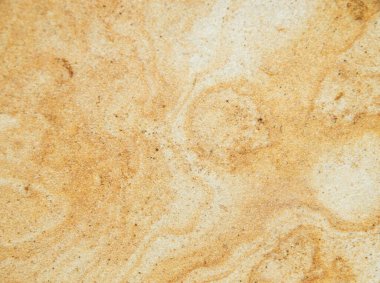 Kum taşından bir tuğlaya yakın, desenli bir arka plan.