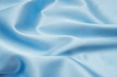 Pürüzsüz mavi ipek arka plan olarak kullanılabilir
