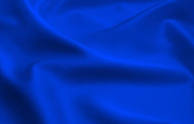Arkaplan olarak mavi saten veya ipek kumaş