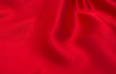 Arkaplan olarak kırmızı saten veya ipek kumaş