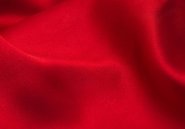 Arkaplan olarak kırmızı saten veya ipek kumaş