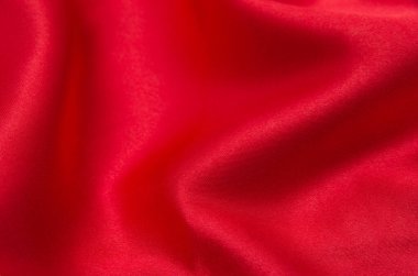 Arkaplan olarak kırmızı saten veya ipek kumaş