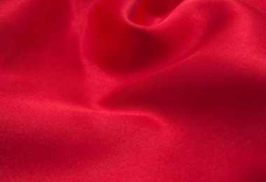 Arkaplan olarak kırmızı saten veya ipek kumaş
