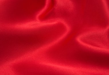 Arkaplan olarak kırmızı saten veya ipek kumaş