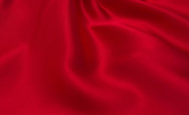 Arkaplan olarak kırmızı saten veya ipek kumaş
