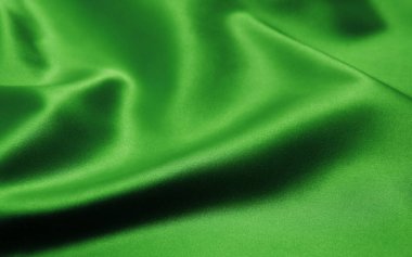 Arkaplan olarak yeşil saten kumaş