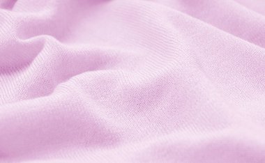 Yünlü pembe bir kumaşın dokusu..