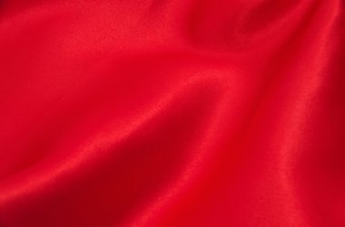 Arkaplan olarak kırmızı saten veya ipek kumaş