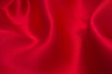 Arkaplan olarak kırmızı saten veya ipek kumaş