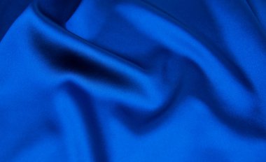 Arkaplan olarak mavi saten veya ipek kumaş