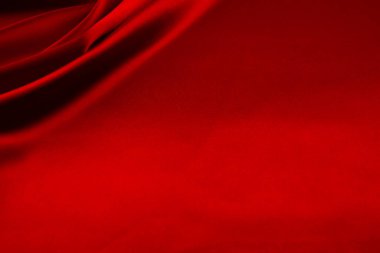Arkaplan olarak kırmızı saten veya ipek kumaş