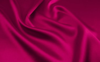 Arkaplan olarak pembe saten veya ipek kumaş
