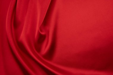 Arkaplan olarak kırmızı saten veya ipek kumaş