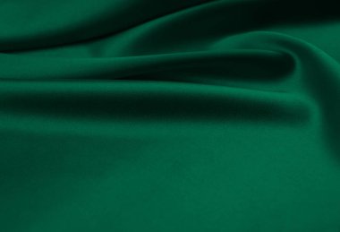Arkaplan olarak yeşil saten kumaş
