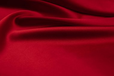 Arkaplan olarak kırmızı saten veya ipek kumaş