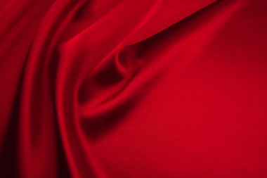 Arkaplan olarak kırmızı saten veya ipek kumaş