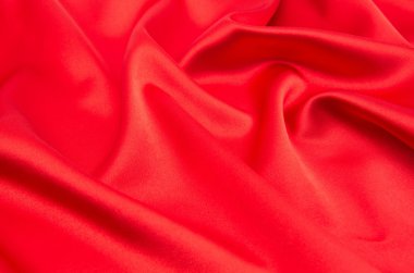 Arkaplan olarak kırmızı saten veya ipek kumaş