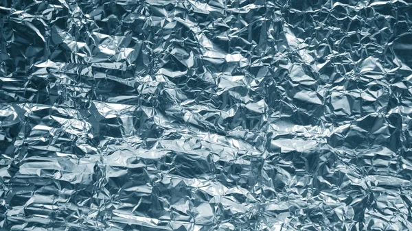 crumpled foil shiny metal texture background wrapping paper for wallpaper decoration element.