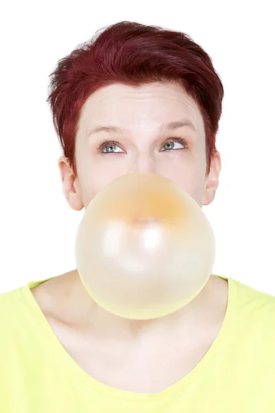 Woman with big yellow bubble of chewing gum — Stock Photo, Image