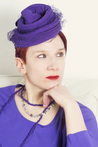 Portrait of woman with purple vintage hat — Stock Photo, Image