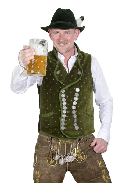 Bavarian man holding a mug of beer — Stock Photo, Image