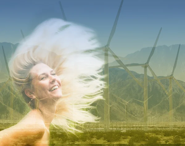 Double exposure of blond woman and wind turbine — Stock Photo, Image