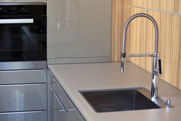 stylish grey kitchen with stainless steel sink