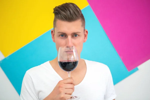 Handsome Blond Man Holding Glass Red Wine Colorful Background — Stock Photo, Image