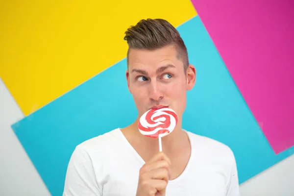 Handsome Blond Man Big Lollipop Colorful Background — Stock Photo, Image