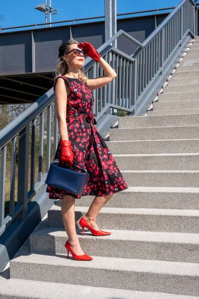 Blonde Woman Red Dress Gloves Holding Purse Standing Stair Steps — Stockfoto