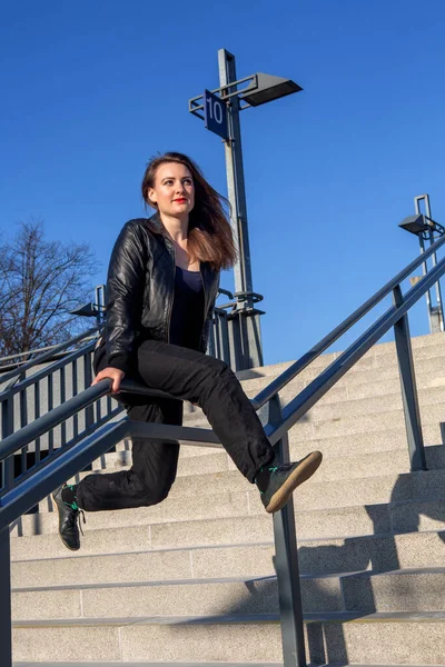 Young Woman Leather Jacket Sitting Outdoors Stair Railing — Stockfoto