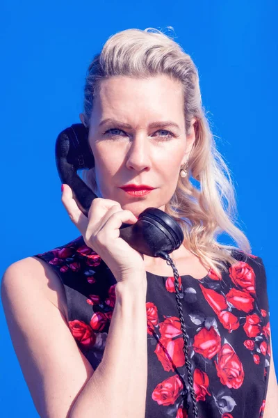 Portrait Blonde Woman Red Dress Retro Black Phone Blue Background — Stock Photo, Image