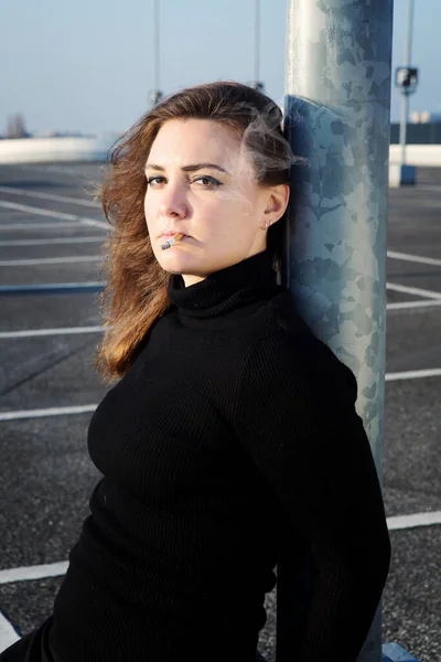 Portrait Young Brunette Woman Smoking Cigarette Outdoors Parking Deck — Stock Photo, Image